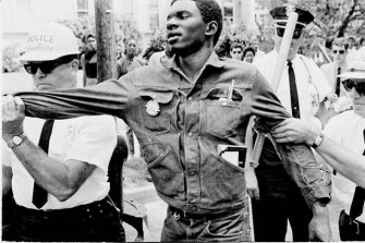 A voting rights proponent being grabbed by police in Greenwood, Miss., in summer, 1964, on Freedom Day. Ted Polumbaum Collection / Newseum