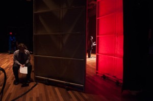 Boston University Anti-War Coalition member David Fontana (left) prepares backstage while Brian Kwoba recites Malcom X’s “Message to the Grassroots”. Photo by Katie Spence.