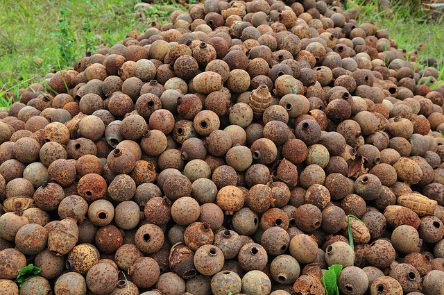 Piles of unexploded ordnance A pile of unexploded ordnance (UXO) that have been cleared. Since more than one third of the land in Laos is contaminated with UXO, the Lao government has prioritized clearing populated areas and land that can be used for agriculture.
