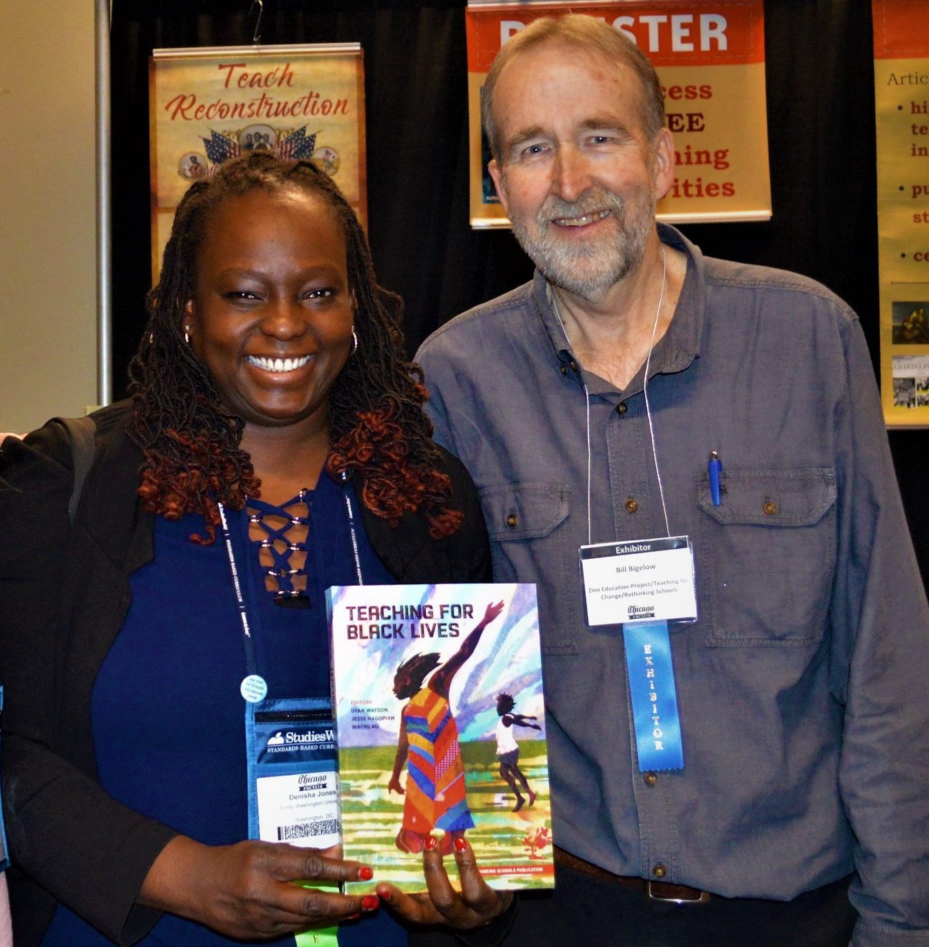 Bill Bigelow and two women at NCSS Chicago 2018 smiling, pose with the book Teaching For Black Lives.