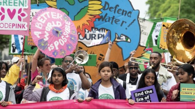 Young people marching and rallying for climate justice.