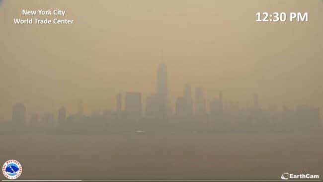 New York City's World Trade Center through the fog of a 2023 heatwave and smoke from climate disasters north of the city.