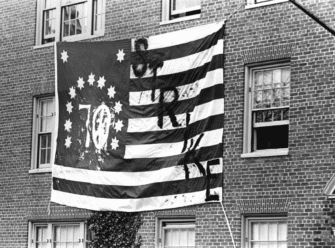 Flag with "70" and "Strike" written on it, hung out of a dorm window during the May 1970 Brown University strike.