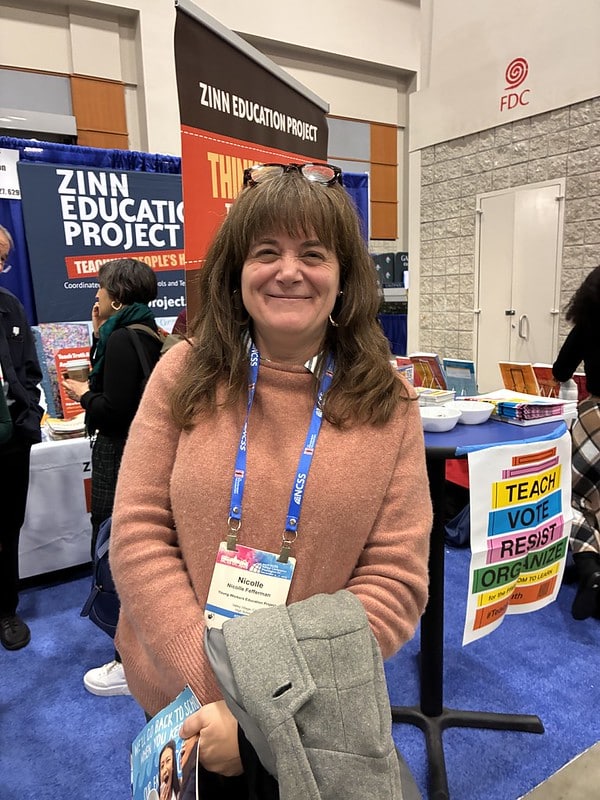 woman smiling at conference booth